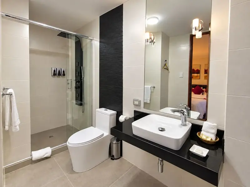 The Suite’s bathroom with a glass shower