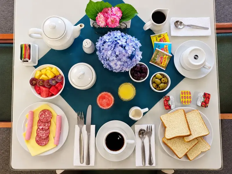 Breakfast served: fruit, bread, juices and coffee