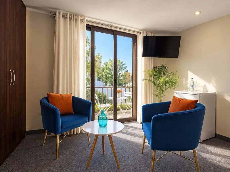 Armchairs by the window in the Single Room