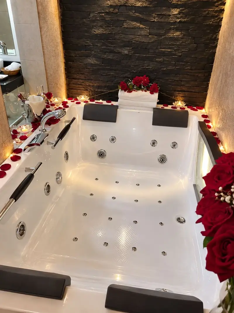 The Suite’s jacuzzi set with petals and candles