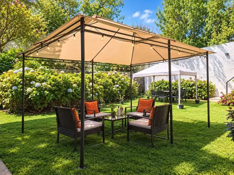 Pergola with armchairs in the garden