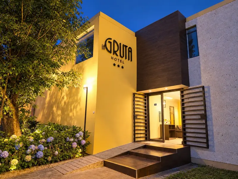 The hotel entrance lit at dusk