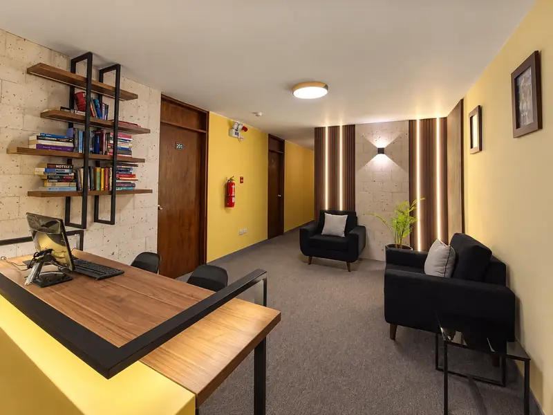 Lounge area with a bookshelf and armchairs